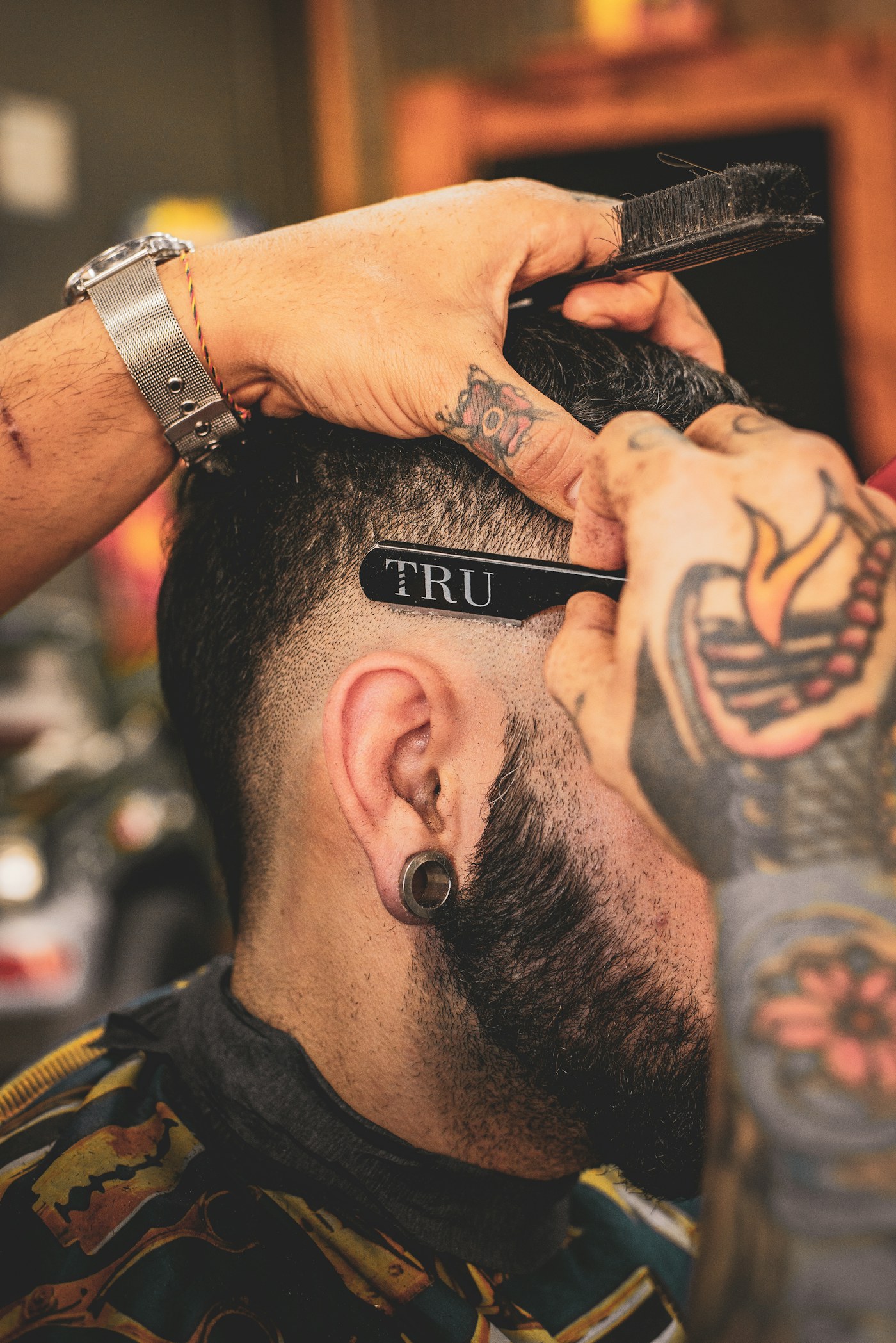 Client receiving the finishing touches on a haircut