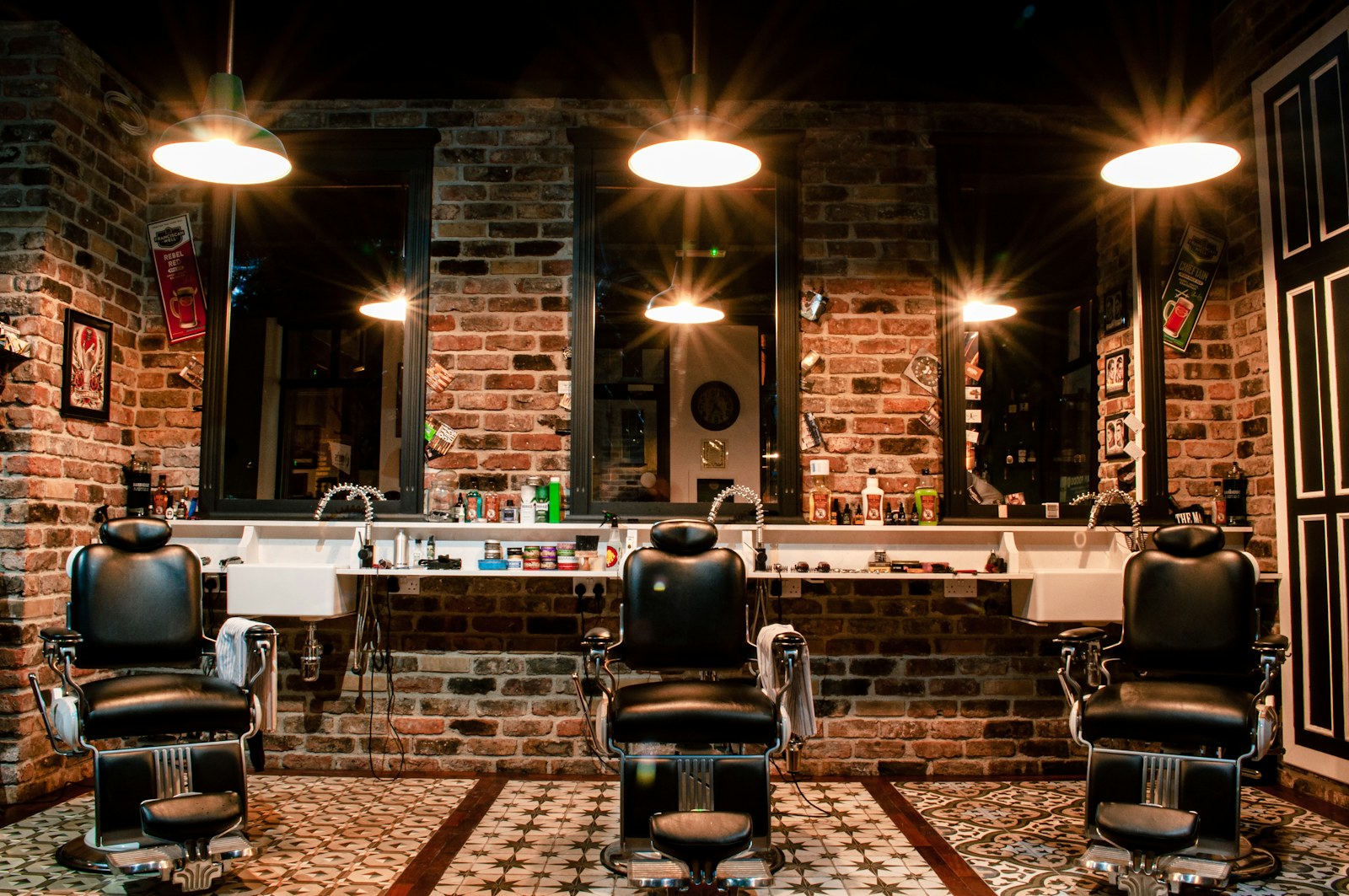 Warm barbershop interior with wood counters, mirrors, and classic chairs